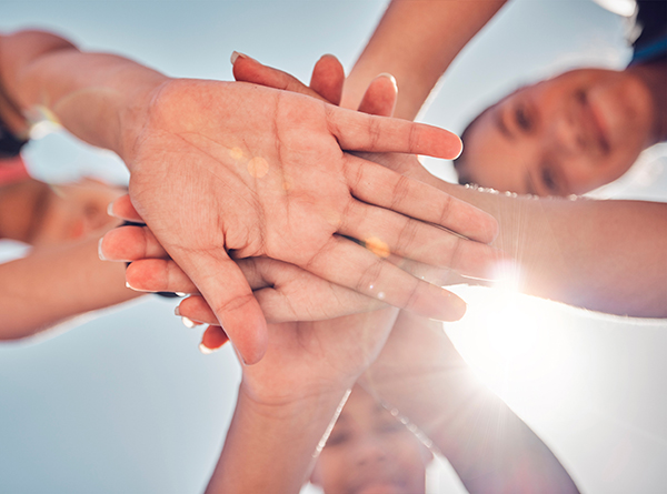 closeup of children holding hands